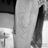 minimal abstract line tattoo of face
