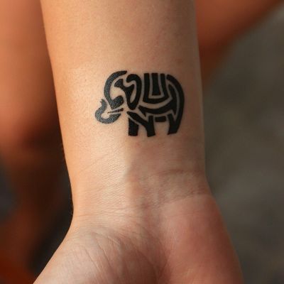 abstract silhouette elephant tattoo