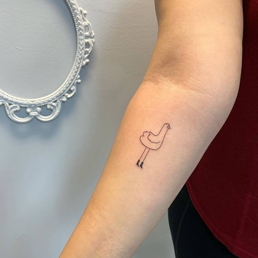 Doodle duck tattoo line art on arm