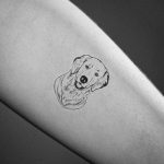 simple golden retriever tattoo on arm