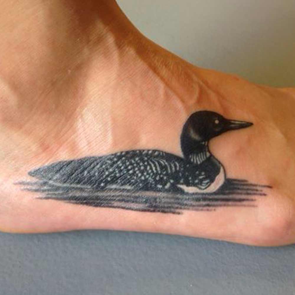 life like duck tattoo on foot